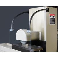 SHD-24188F shield assembly with two optional BKT-150 mounting brackets on a surface grinder.